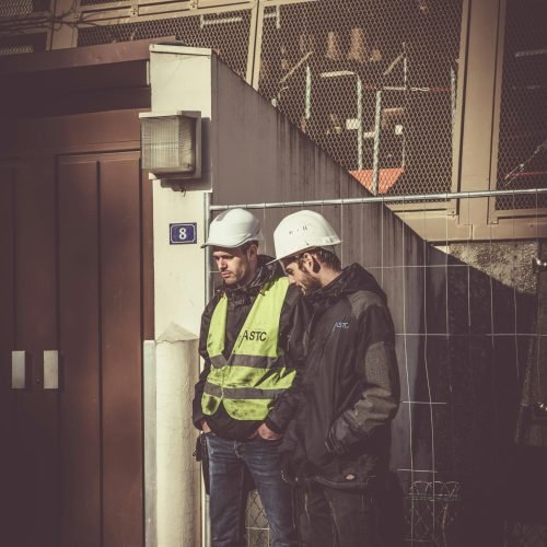 Two Men Wearing White Hard Hat